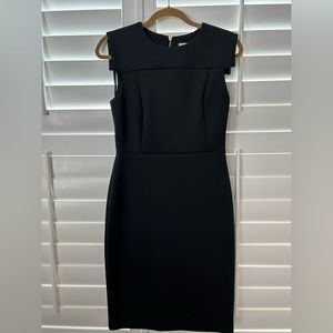 CALVIN KLEIN stretchy black dress size 4 with gold exposed zipper on the back.